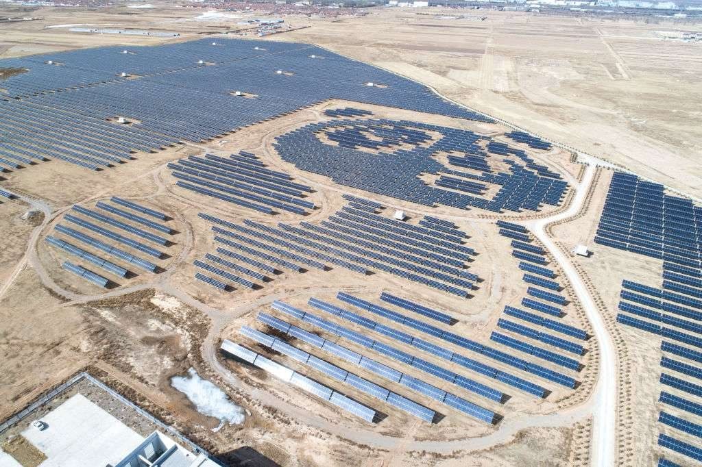 Solar farm with access roads between panel arrays