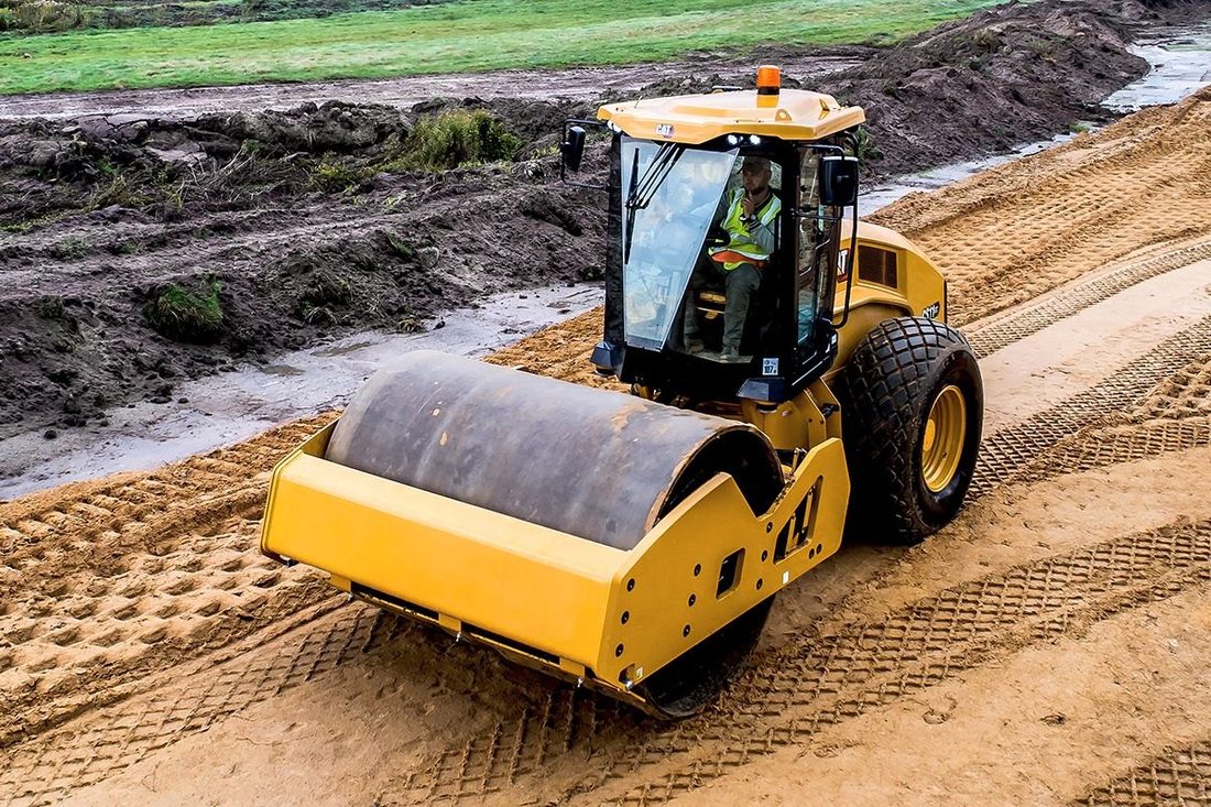 Compaction roller engineering a road surface